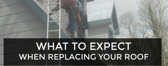 Roofers replacing a house roof.