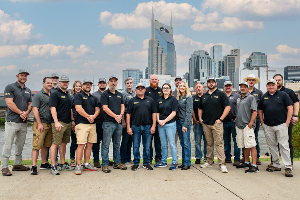 Roofing MidSouth Construction Teamconstruction roofing staff members in front of the nashville skyline