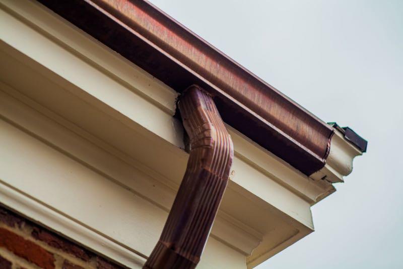 A close up of the gutter on top of a house