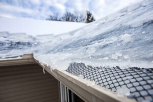 A close up of the roof of a house covered in ice