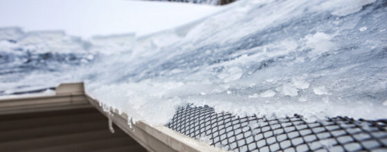 A close up of the roof of a house covered in ice