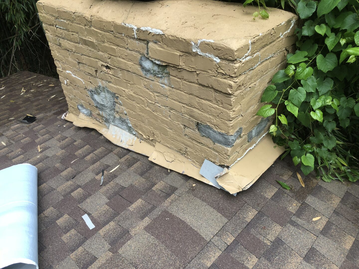 A stack of cardboard boxes on the ground.