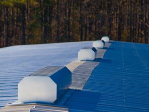 A row of white and blue metal roof panels.