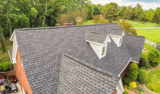 Aerial view of an asphalt shingle roof from GAF in Charcoal Color