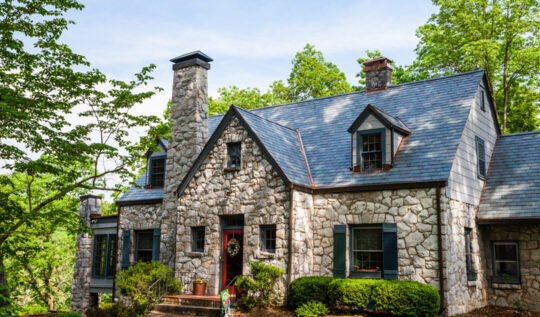 Front view of a home with a slate roof replacement