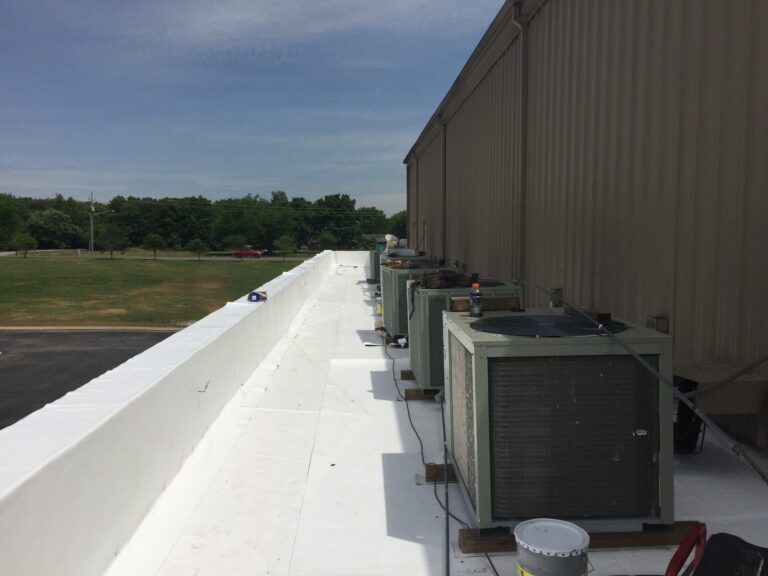 TPO roofing on a commercial building with HVAC units.