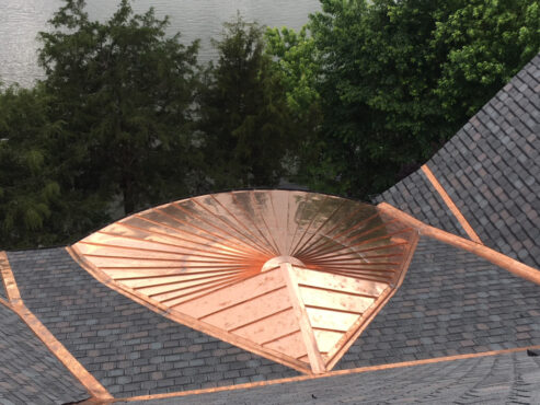 Copper Roofing used for accent on designer shingle roof